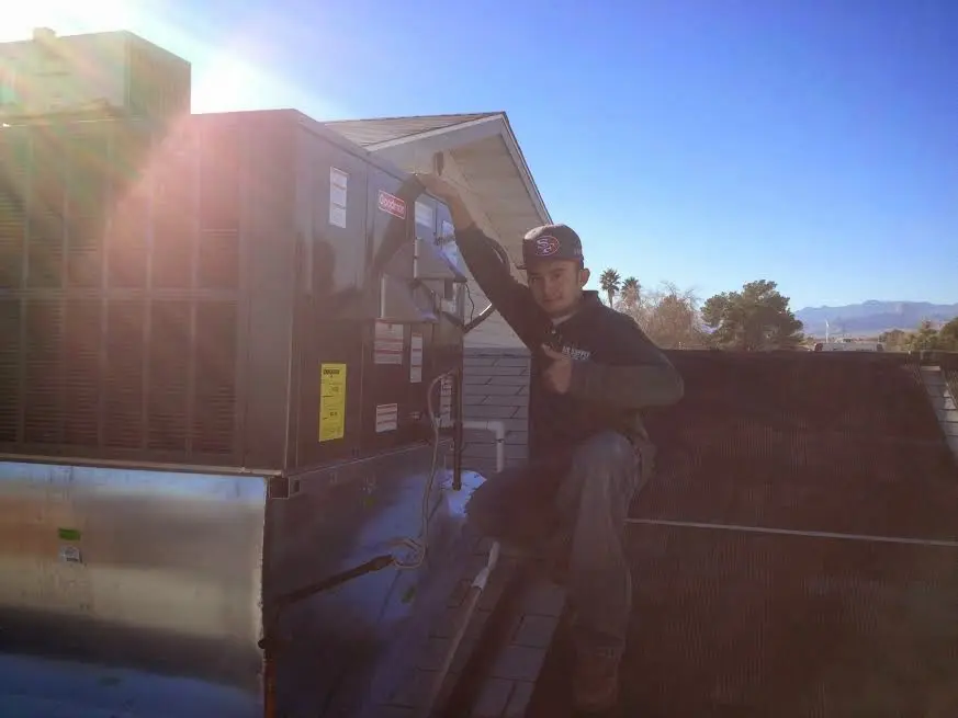 HVAC technician performing HVAC Inspection on a rooftop unit in East Whittier